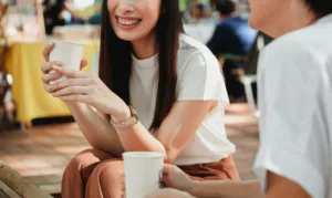 Close up image of people drinking coffee