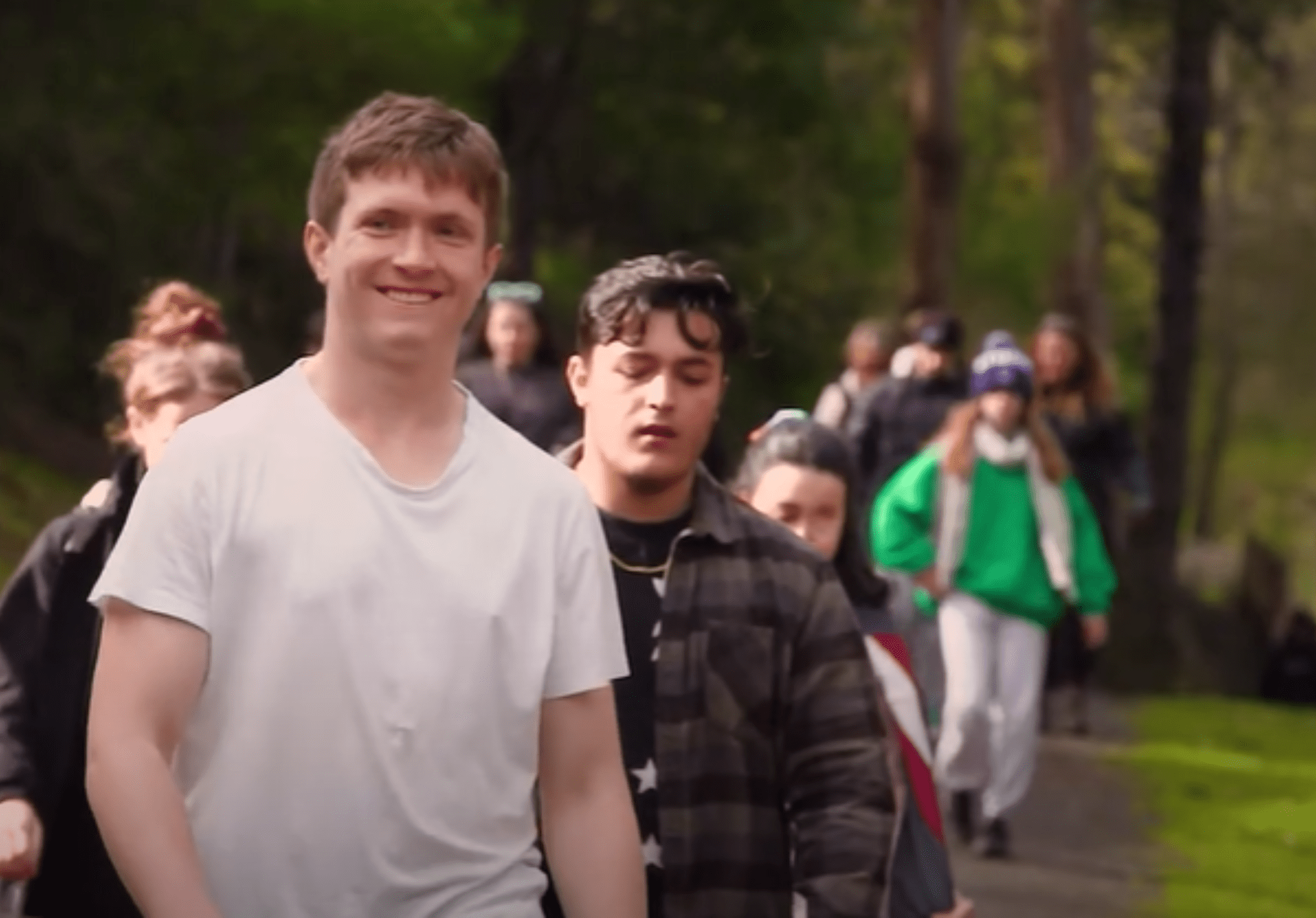 A group of adolescents are walking outdoors